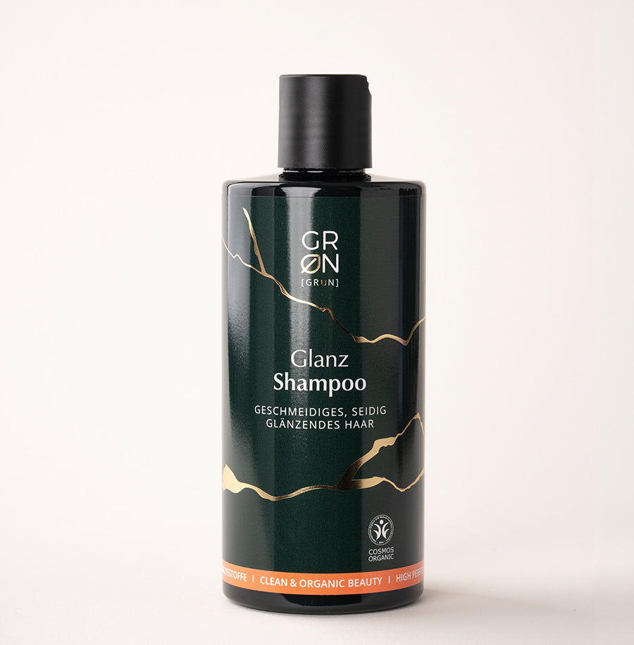 Flasche des Shampoo Glanz mit Irischem Moos und Meereskiefernextrakt; verbessert Kämmbarkeit, spendet Feuchtigkeit und verleiht glänzendes, geschmeidiges Haar